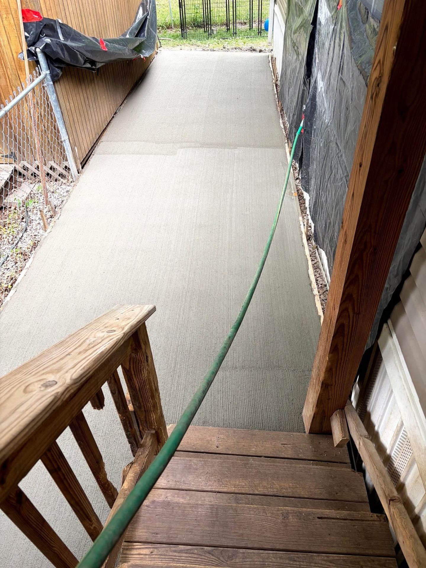 After — Completed broom-finish concrete walkway after the pour
