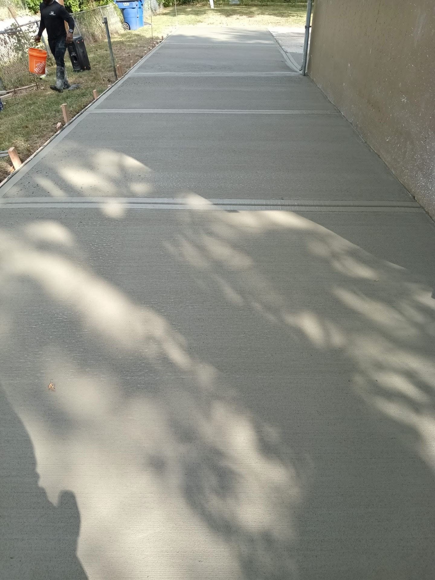Completed concrete walkway alongside a building
