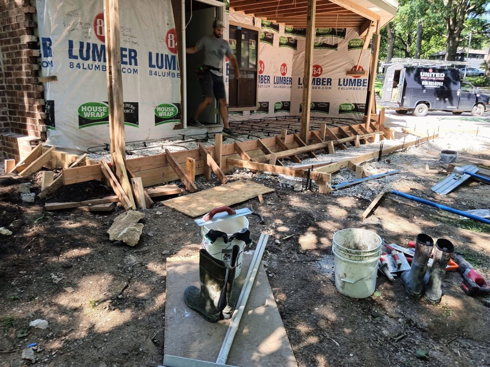 Wood forms and rebar set for a concrete porch and patio pour