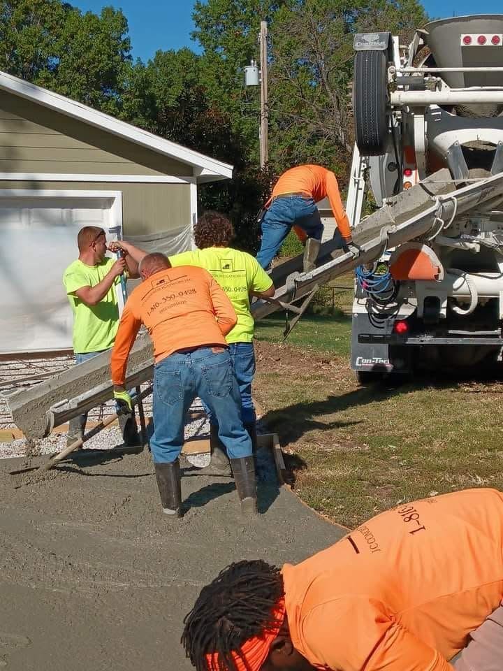 J C Concrete Flatwork crew placing concrete from a mixer truck